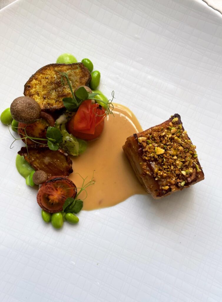 32 hour pork belly- miso sauce- roasted jerusalem artichockes - tomato’s and green beans -pistache crumble