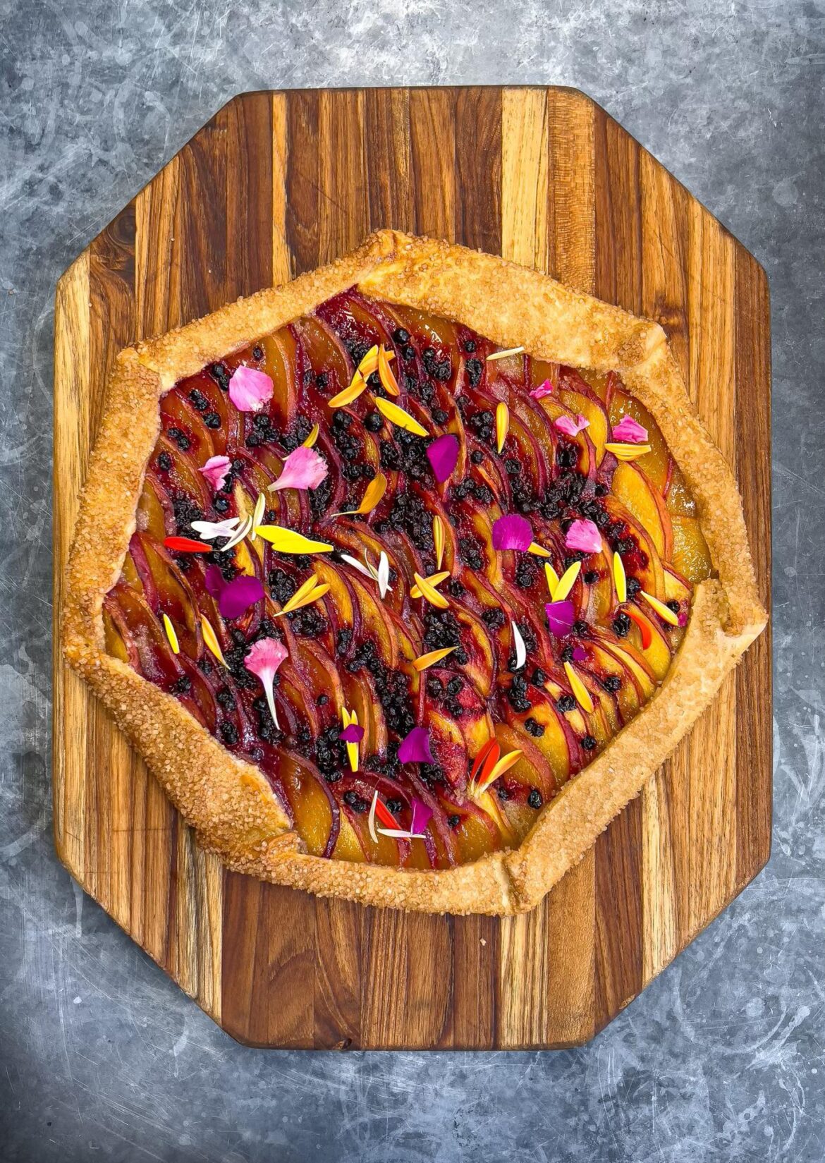 Summer Peach Galette: Frog Hollow Farm Peaches (CA), Wild Huckleberries. Gets served with house made vanilla ice cream.