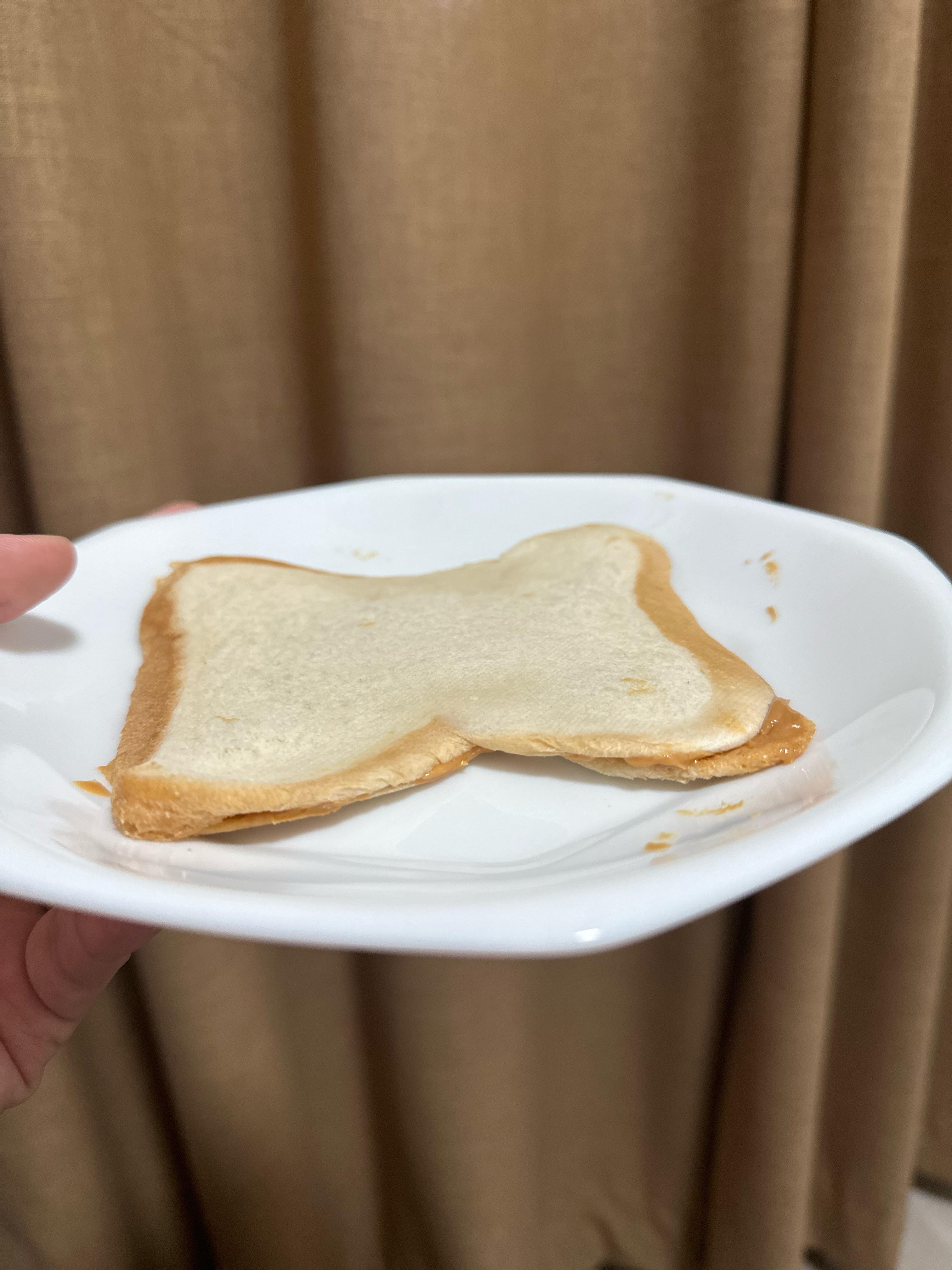 thin crust peanut butter sandwich (i cant open my jaw because