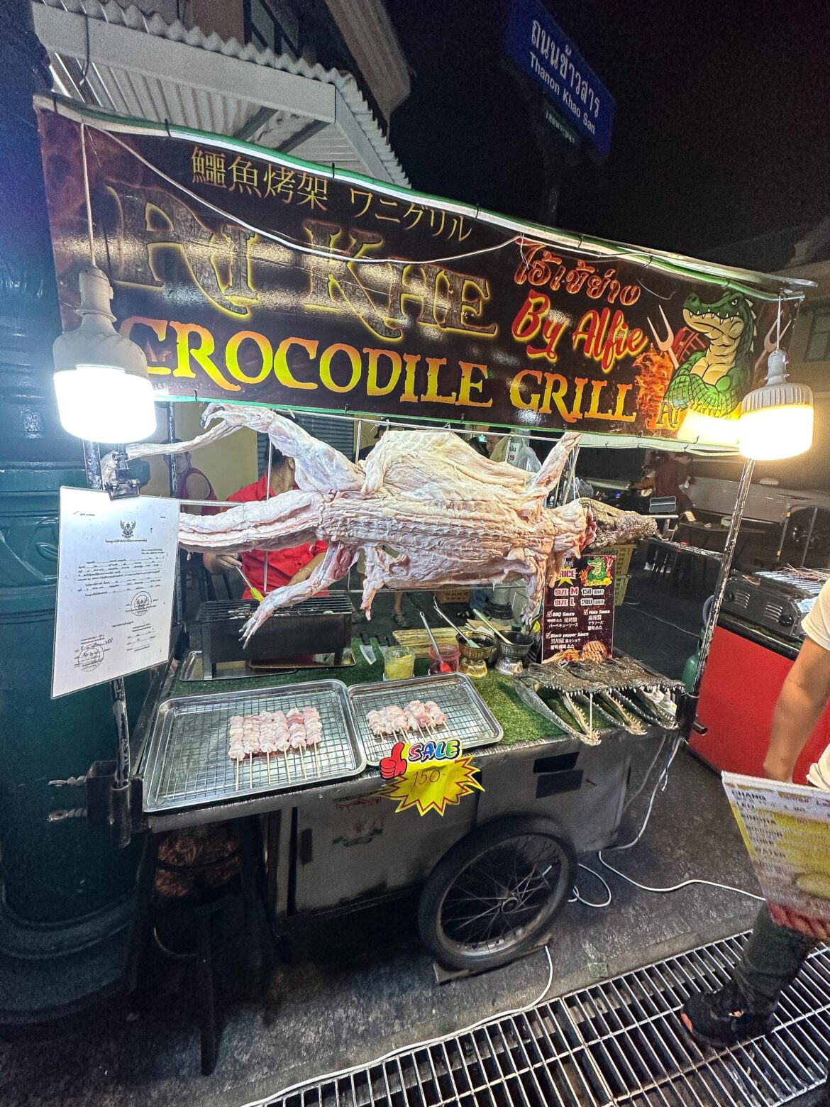 Grilled crocodile skewers in Khaosan Road, Bangkok, Thailand