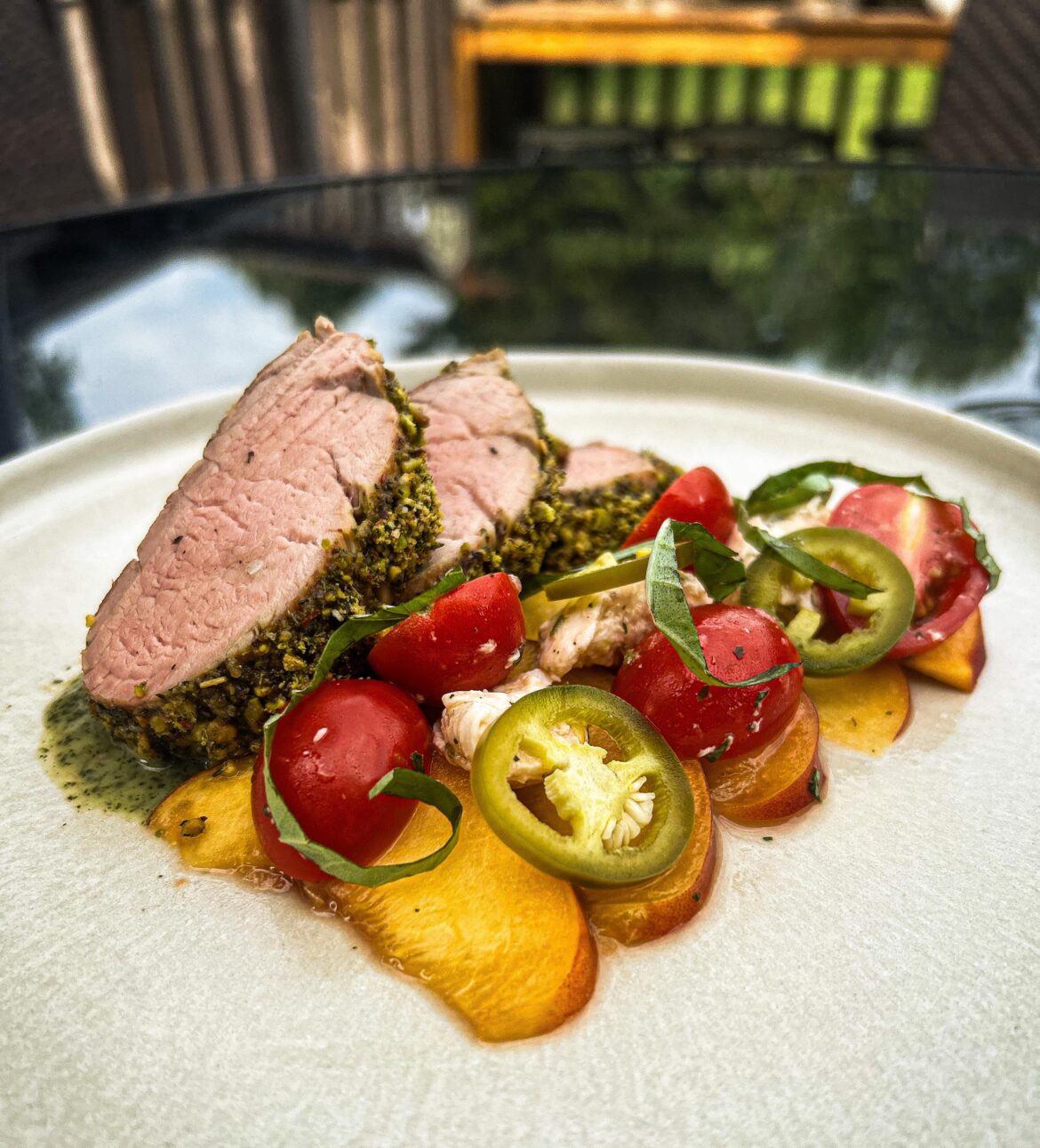 Pistachio crusted pork tenderloin with a peach jalapeño salad