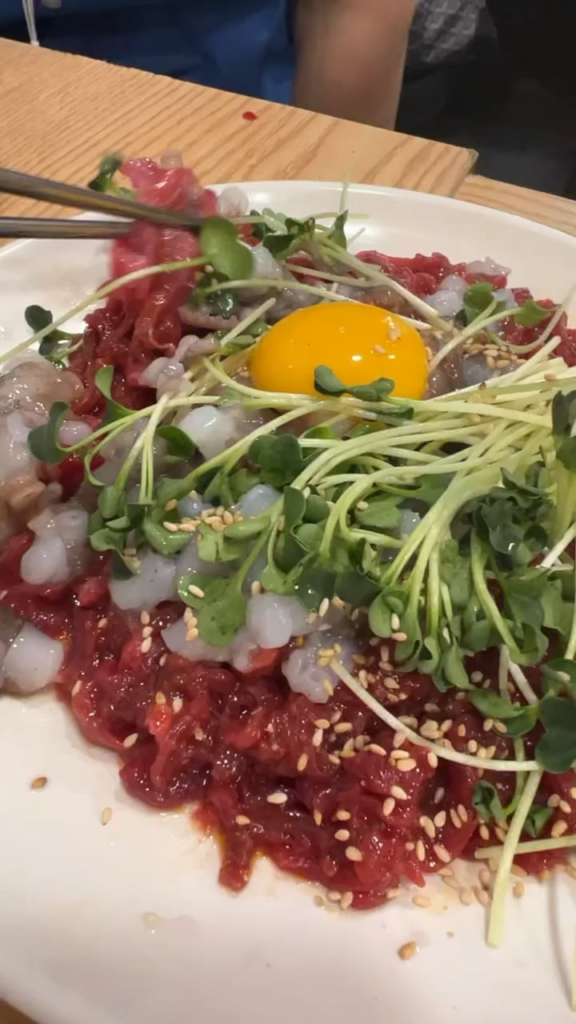 A Perfect Pairing: Raw Beef Tartare and Fresh Octopus Sashimi - A Must-Try Delight at Seoul's Gwang-jang Market!