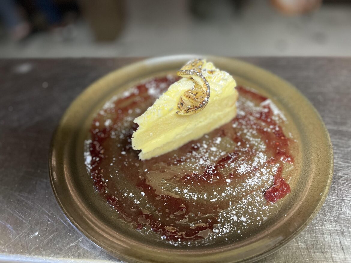 Limoncello Marscapone Cake, house rasberry lemon jam, powdered sugar, charred citrus