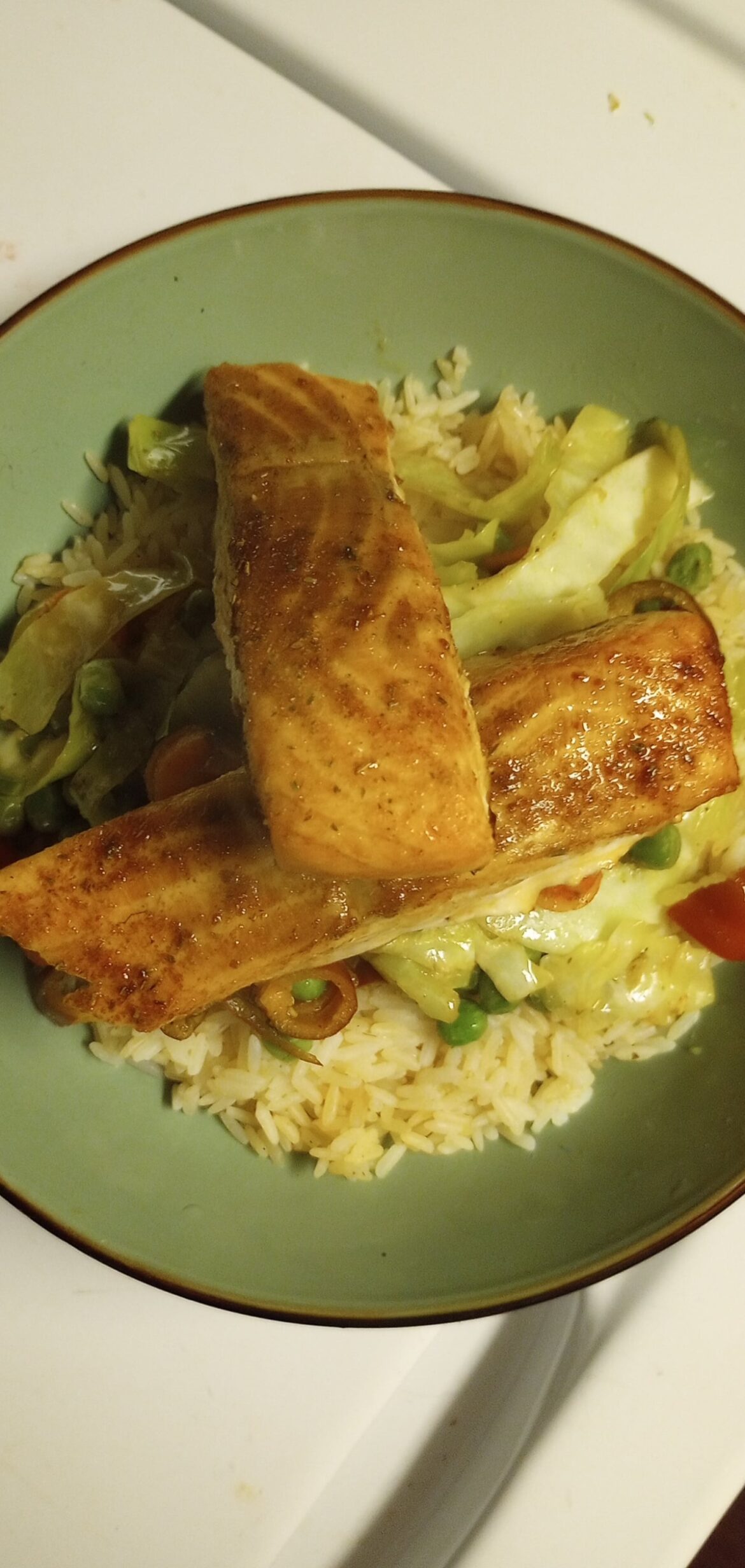A little salmon, rice, cabbage, peas and peppers.