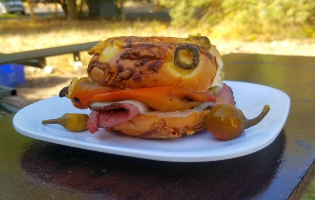Pastrami, provolone, and roasted Hatch chile jalapeno cheese bagel. And Pickled cherry peppers for that third pepper dimension .
