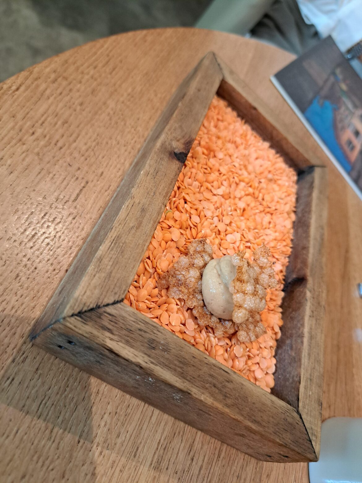 Dont know if the orage things are edible, but they stick to the hummus