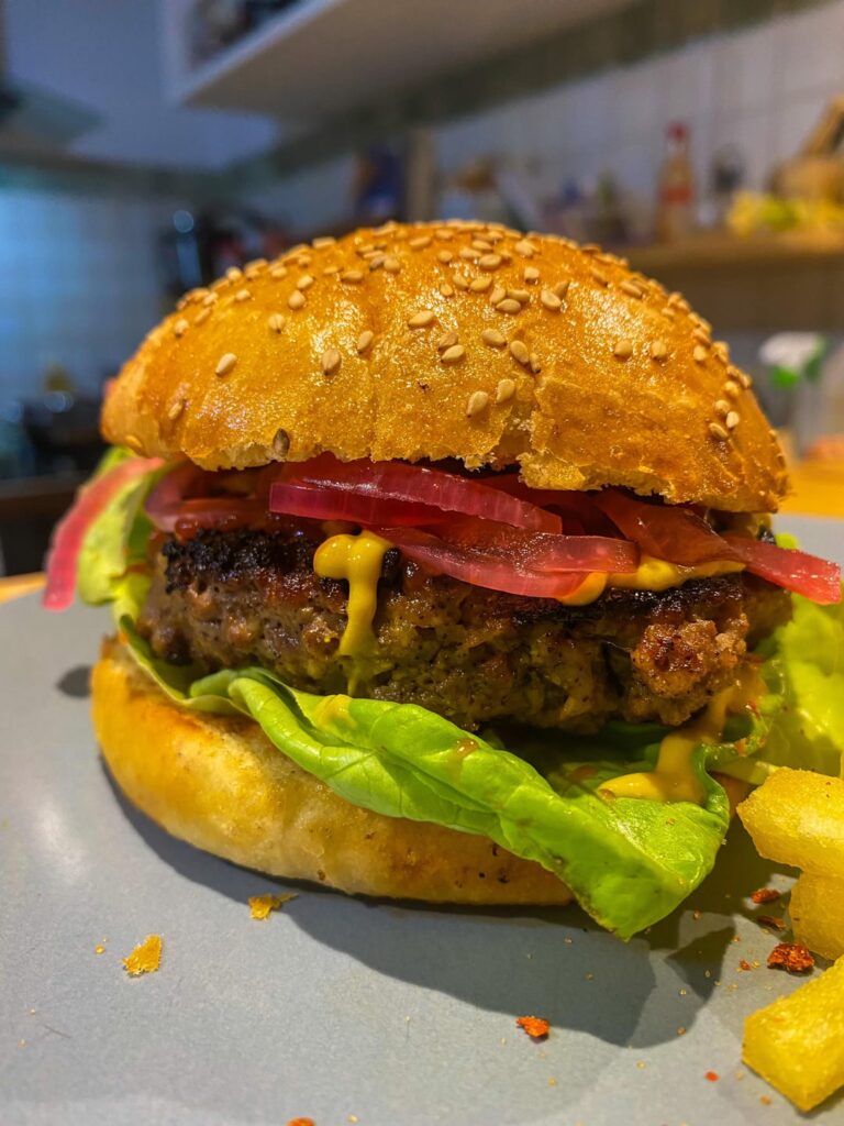 homemade burgers in homemade buns with some triple cooked fries