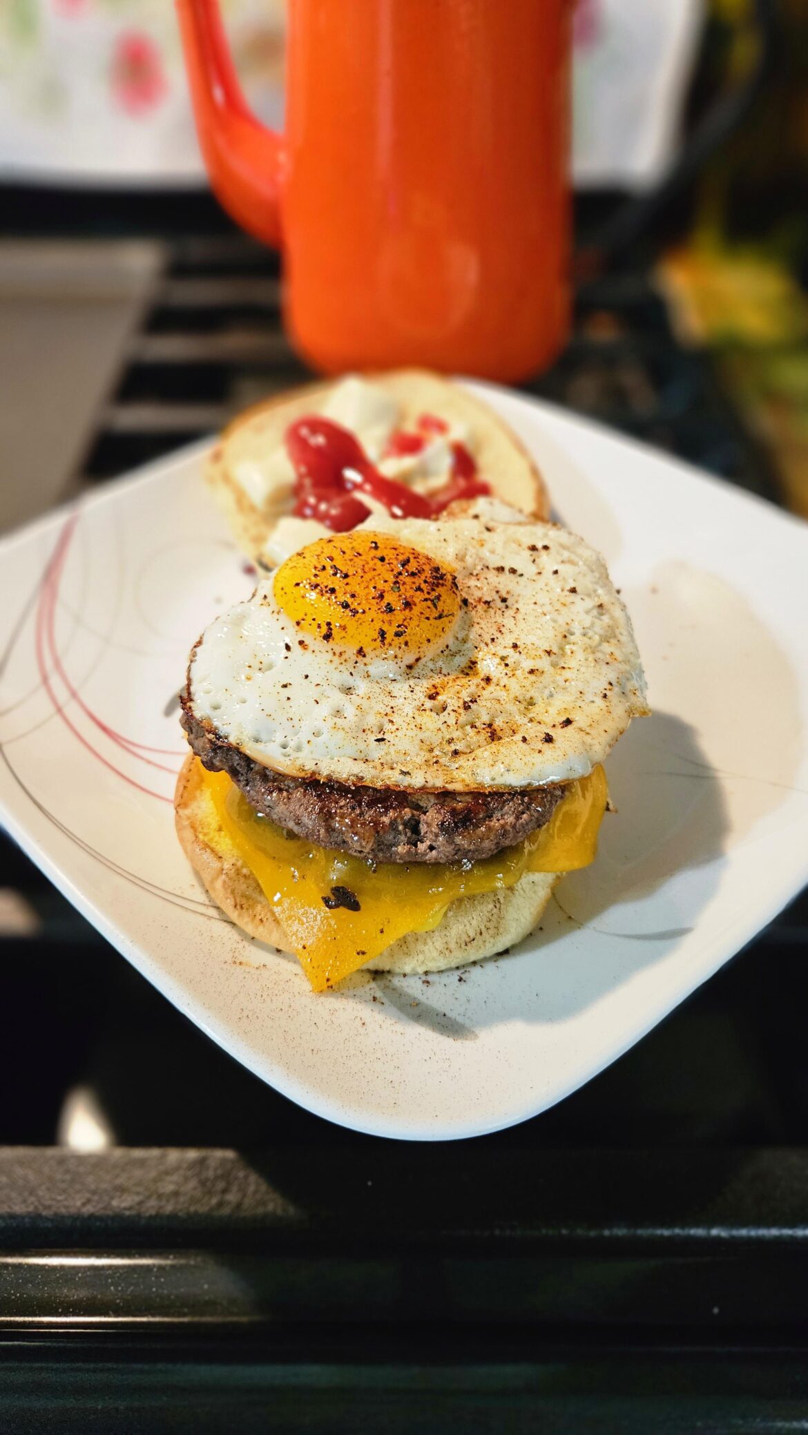 Cheese burger with an egg on it.