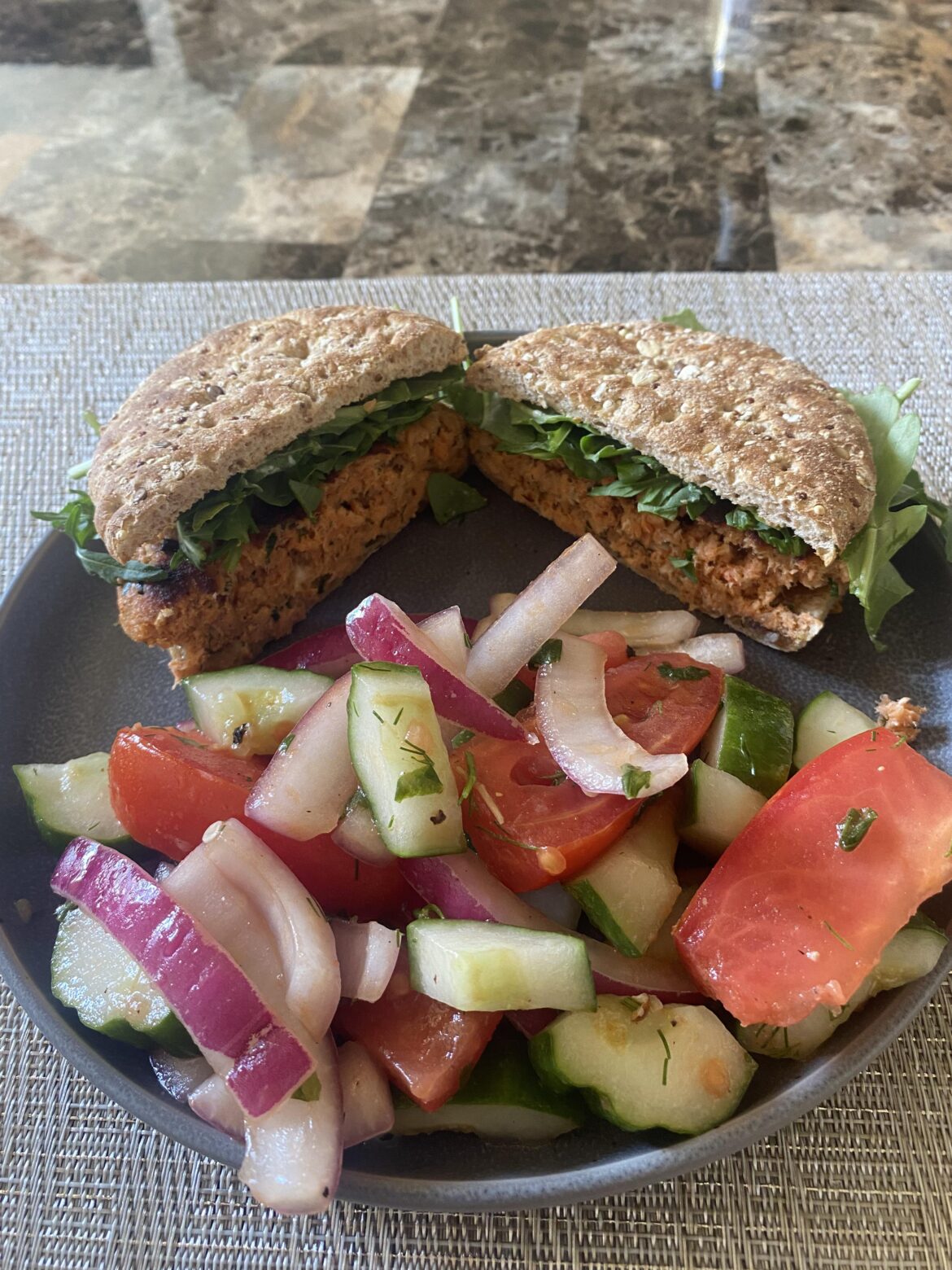 Salmon burger w/lemon-dill aioli and arugula