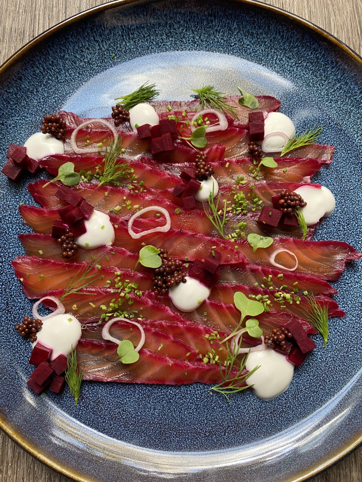 Beer cured salmon with pickled beets, pickled mustard seeds, sour coco cream, herbs