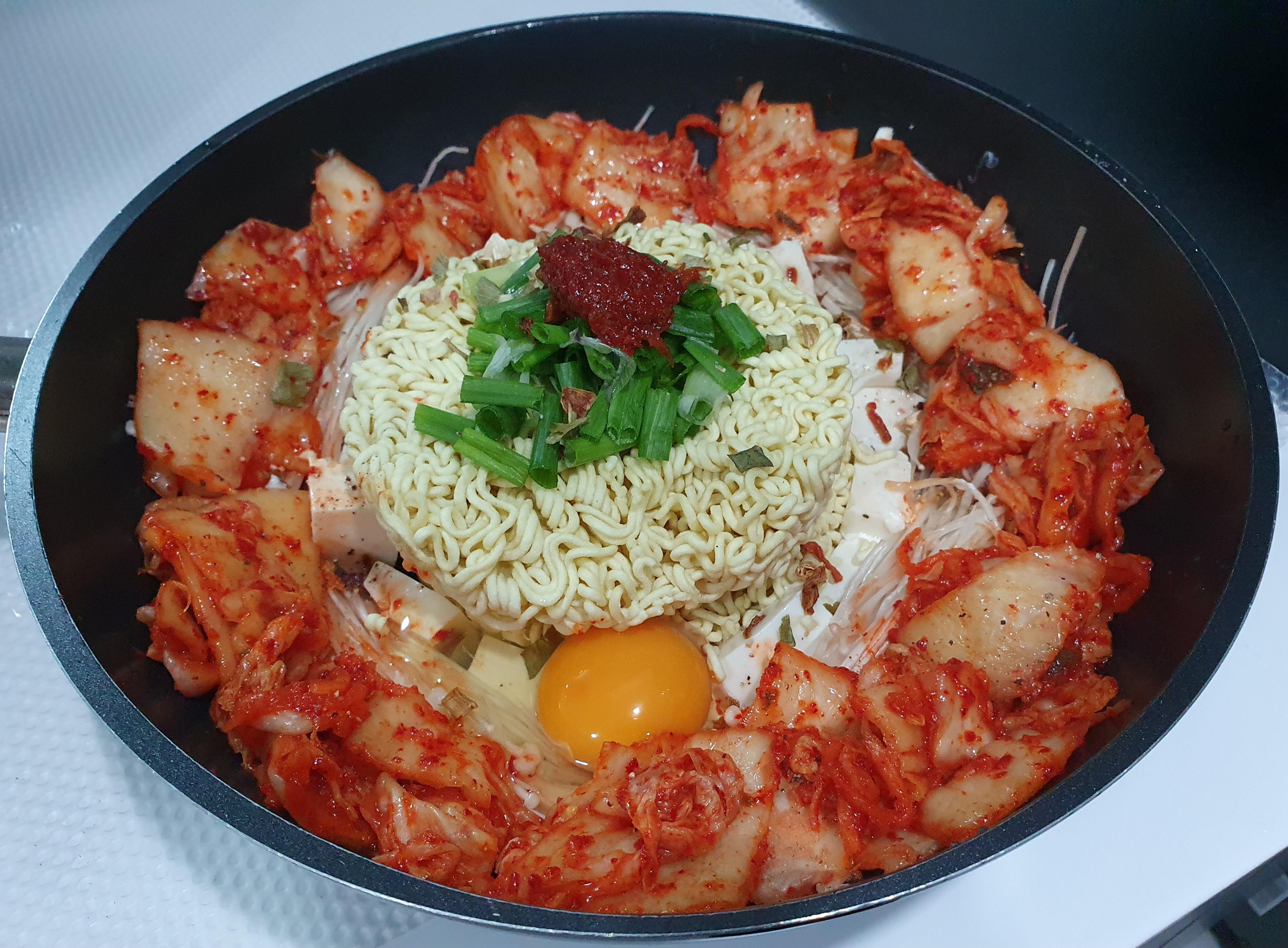 Kimchi Ramen with tofu, egg, enoki mushroom, scallion and gochujang