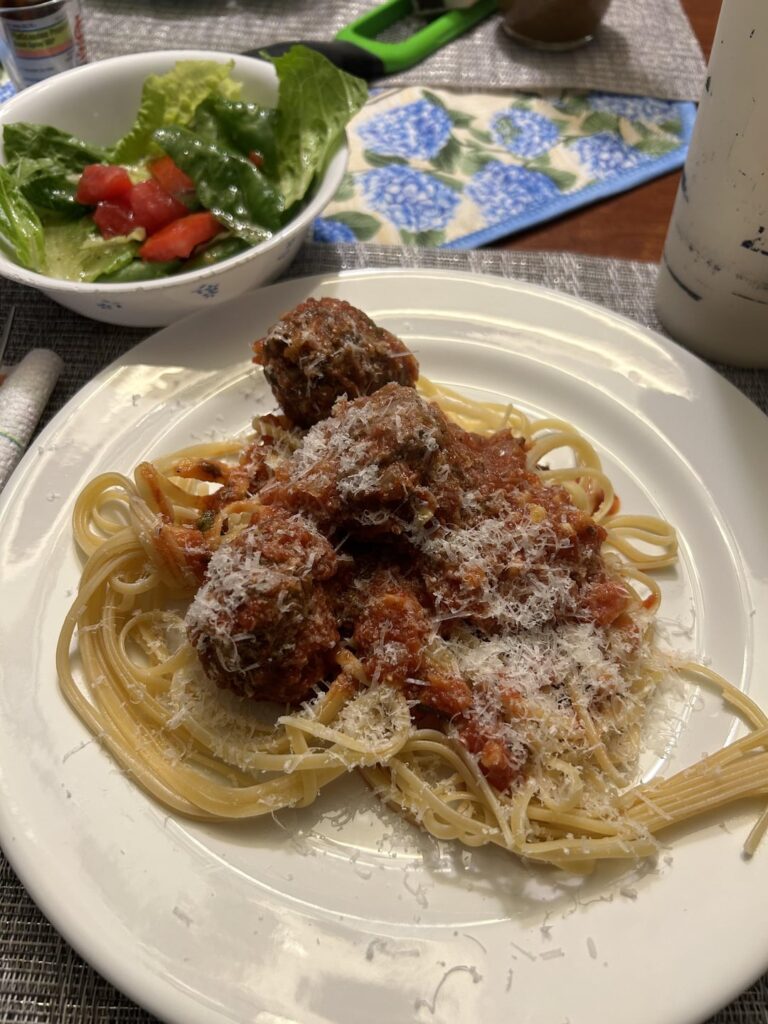 Linguini with meatballs and a side salad