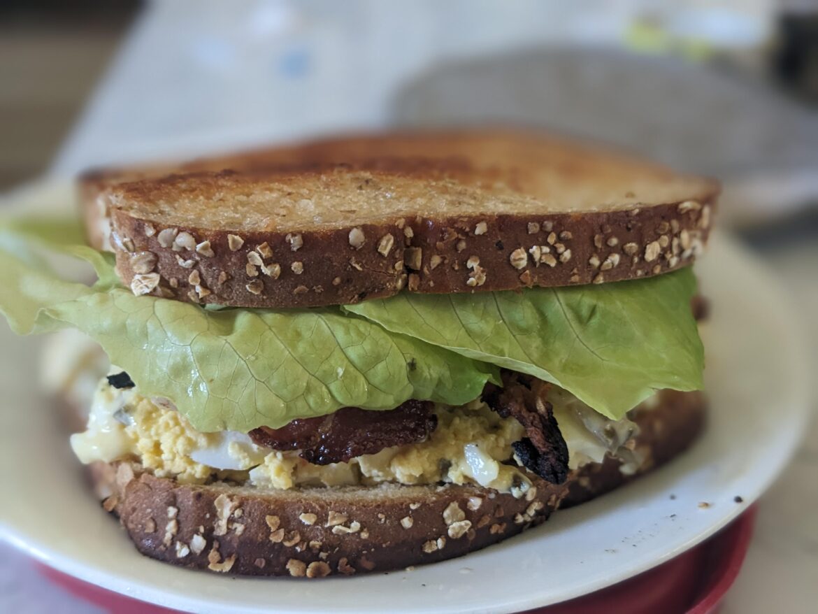 Egg salad with bacon, lettuce and a crispy grilled butter crust.