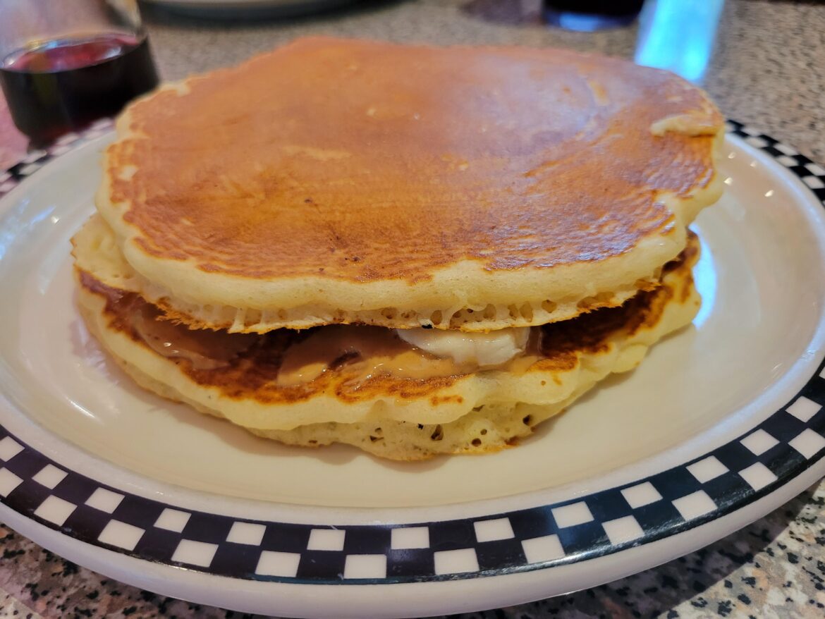 Giant peanut butter and banana pancake breakfast sandwich.