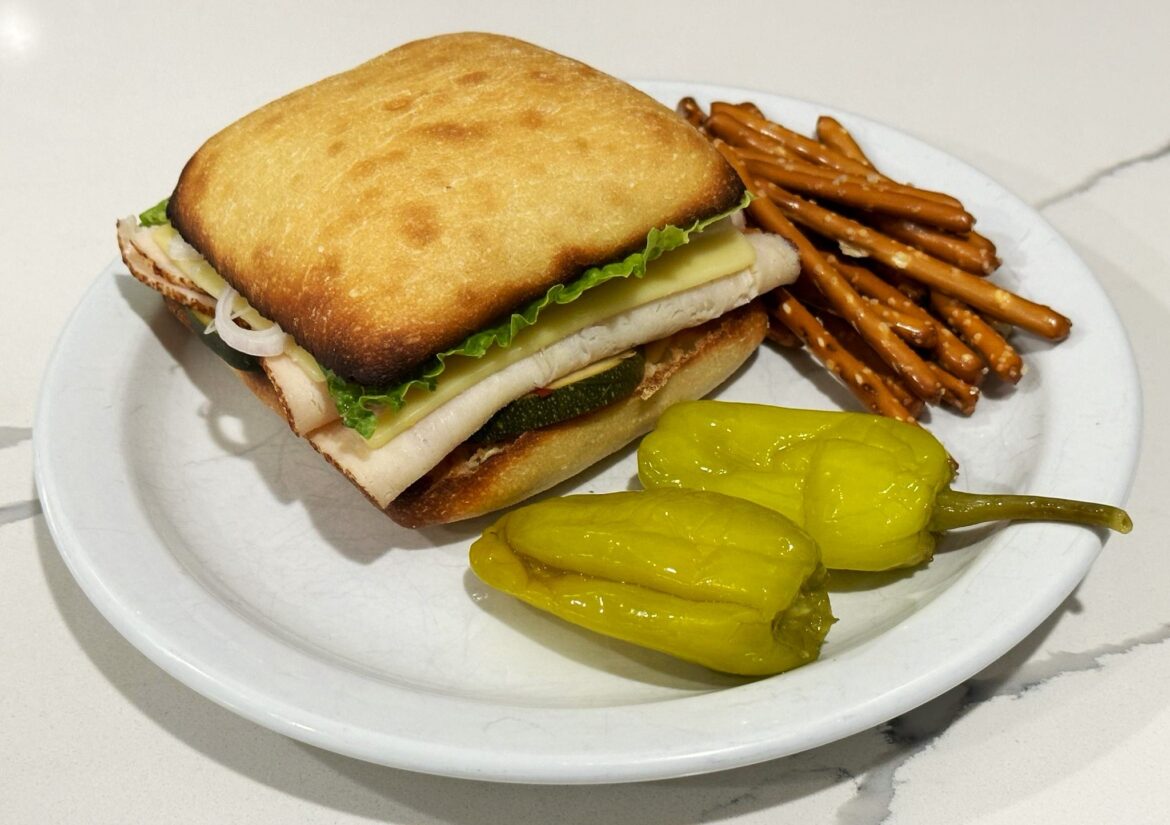 roast chicken breast and swiss on buttered and toasted ciabatta w/pickled zucchini, shallot, lettuce mayo and dijon