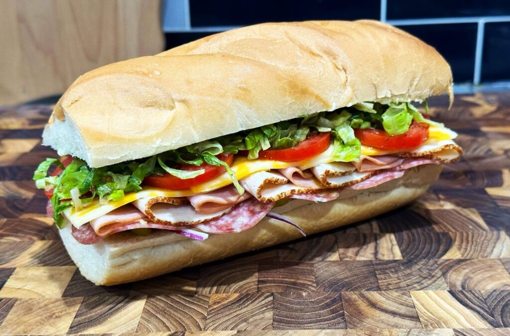 salami, roast chicken, ham and colby jack w/ lettuce, tomato, red onion, pickle, pepperocini, sub dressing, mayo and spicy brown mustard.