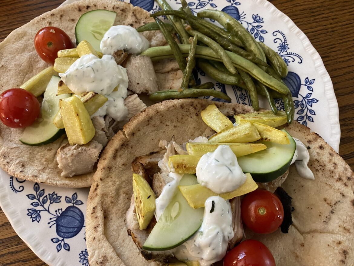 Grilled chicken, vegetables, and yogurt dill sauce on pitas. Garlicky green beans on the side