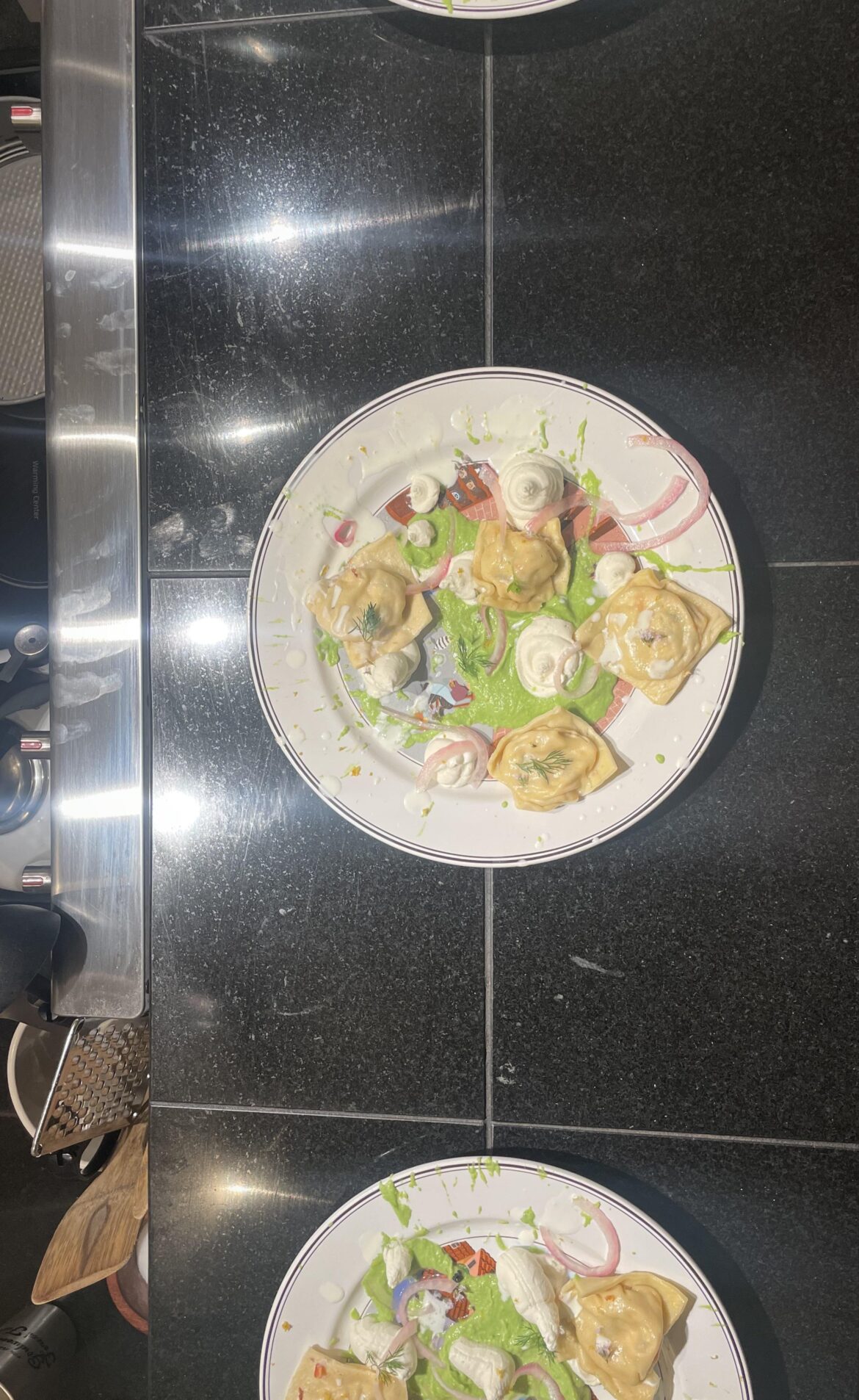 Smoked salmon ravioli, mint sweet pea purée, parmesan mousse, and lemon/dill cold infused cream