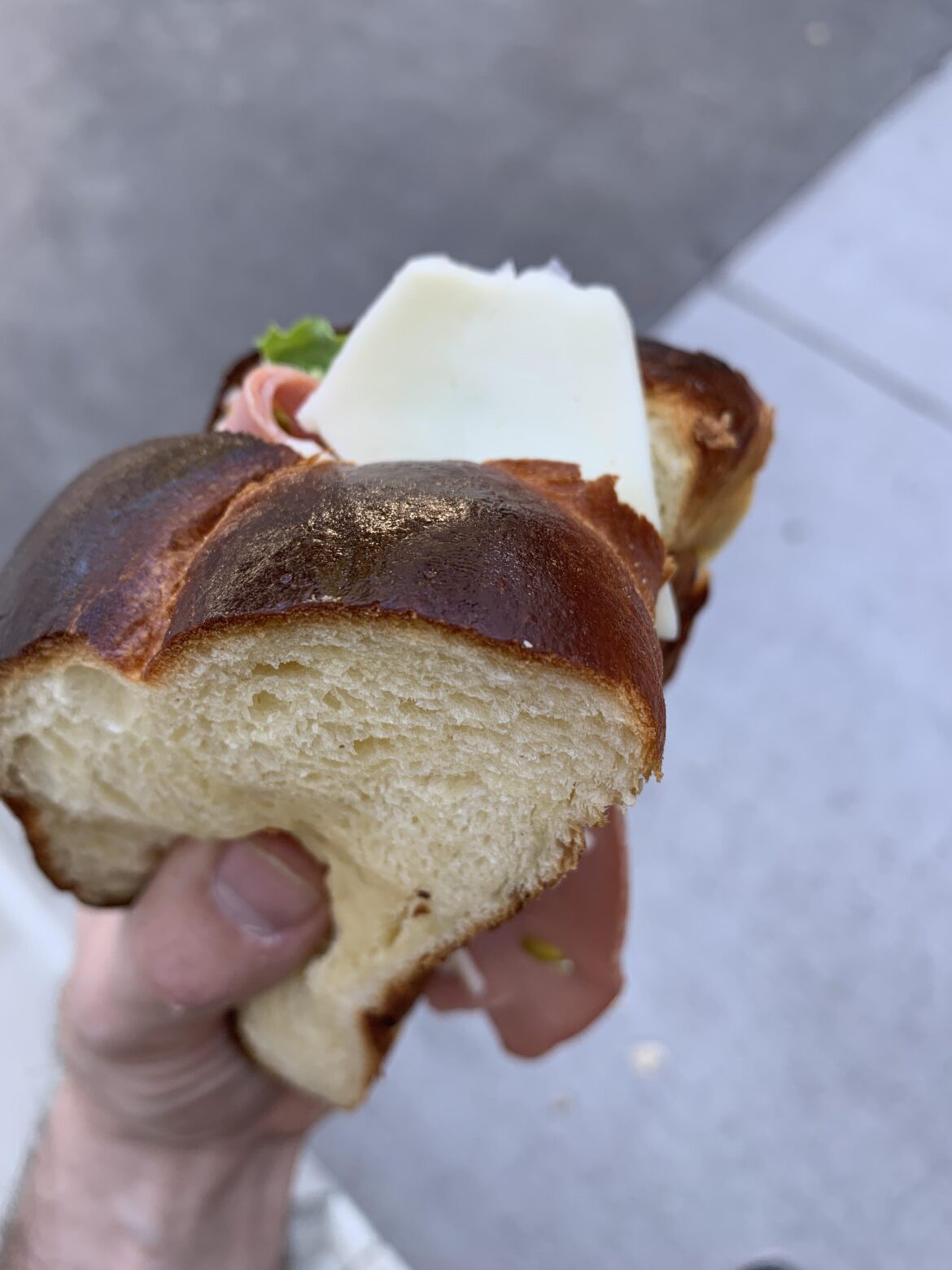 Mortadella, asiago, lettuce, and dijonaise, on freshly baked challah.