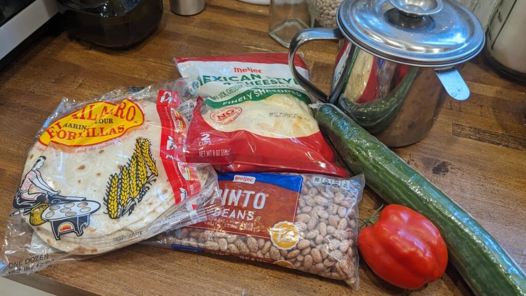 Refried beans. About $1.75 per serving.