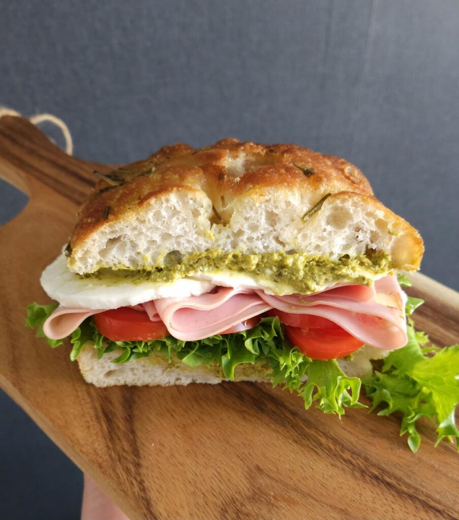 Mortadella, pesto, mozzarella, cherry tomatoes and lettuce, on a rosemary and sea salt focaccia.