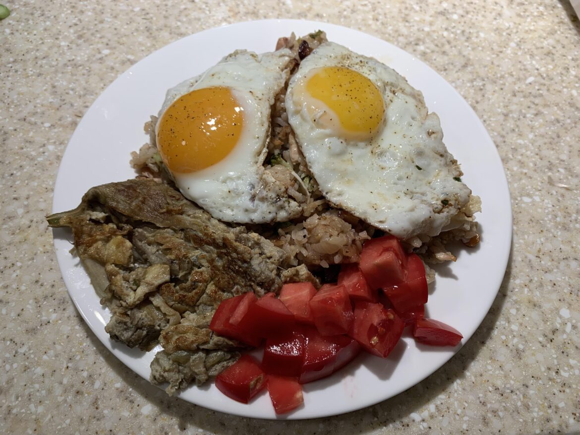 Fridge clear out fried rice with eggs, diced tomatoes, and tortang talong