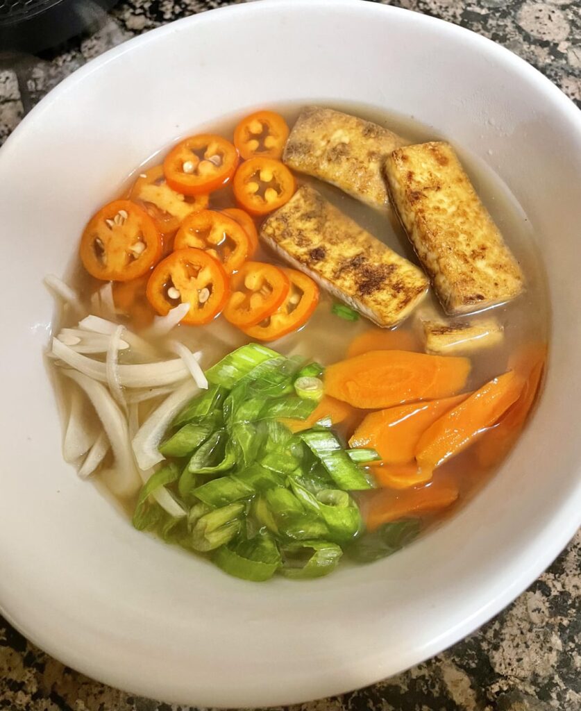Homemade vegan pho, pre and post Thai basil