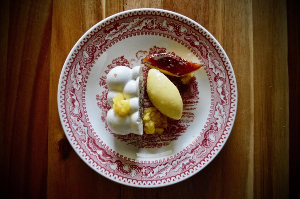 Hummingbird Cake, Cream Cheese Mousse, Caramelized Banana, Pineapple Sorbet, Candied Pecan