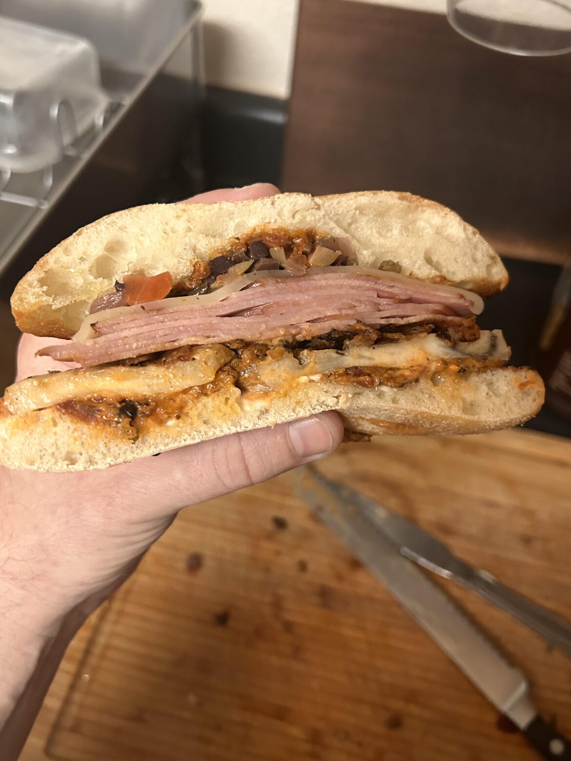 Fried eggplant, ham, provolone, Muffuletta olive mix on a toasted Ciabatta roll with mayo and sun dried tomato spread.