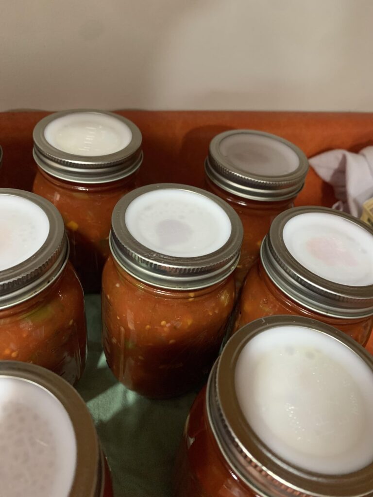 Jars lost their headspace after water bath canning…water seepage?