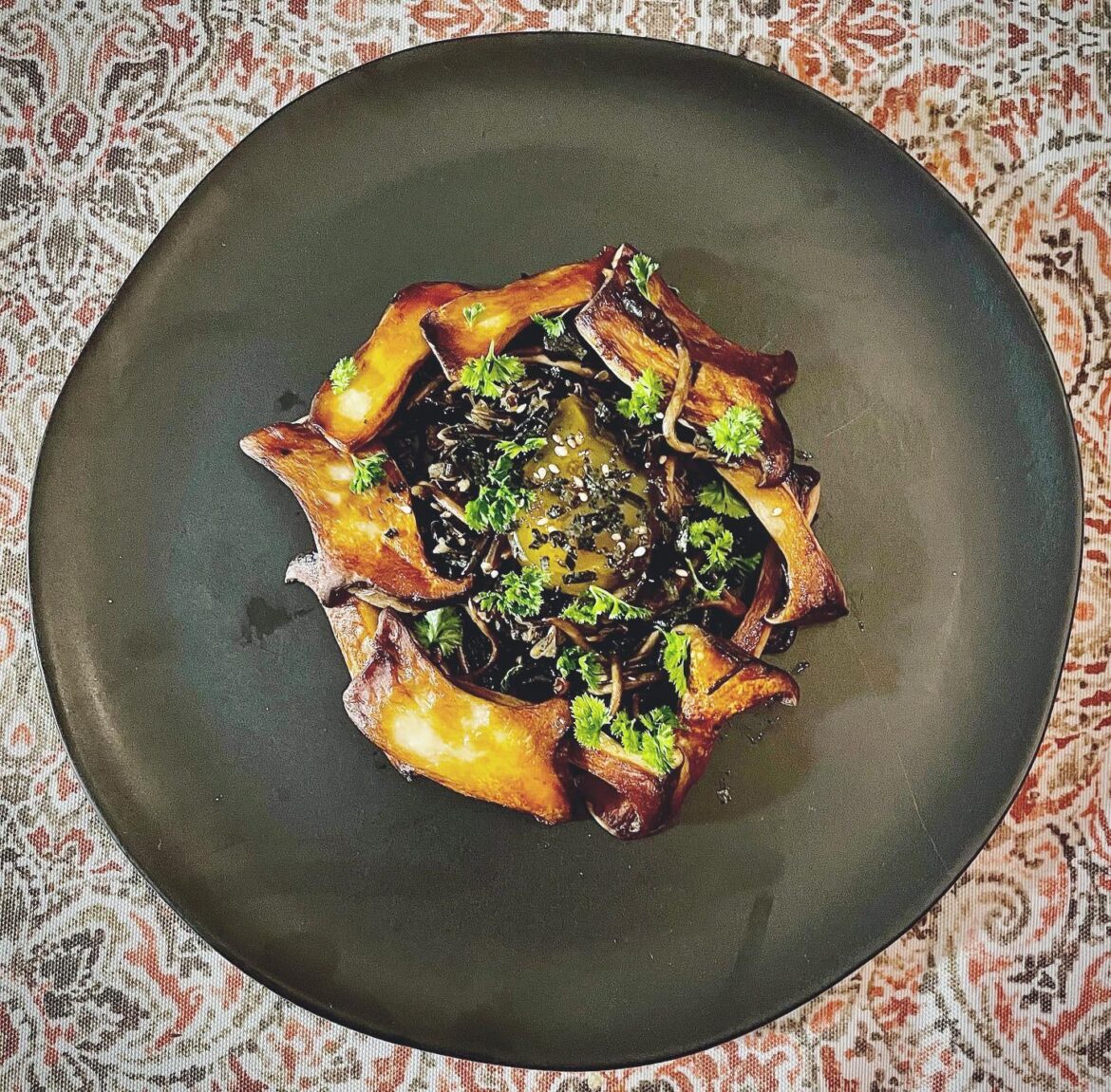 Confit and crisped trumpet mushrooms, soy cured egg yolk, wild rice.