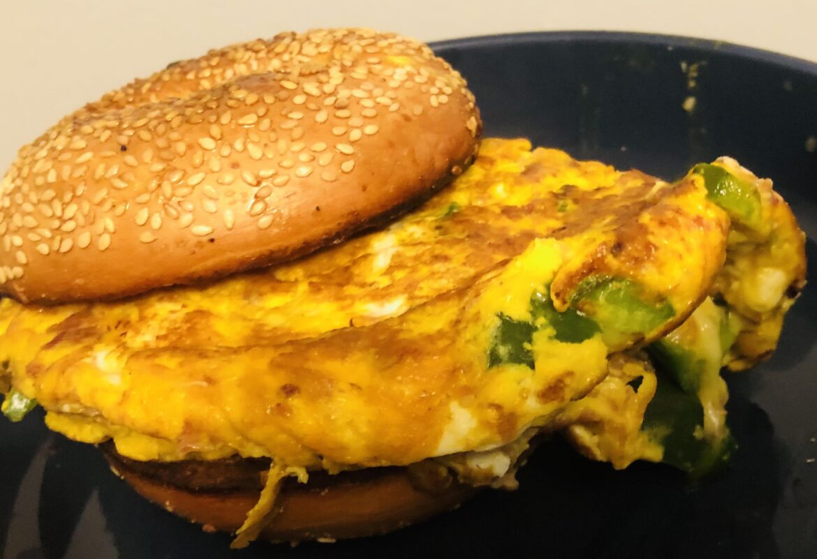 Jalapeno, Aged Cheddar, Bacon Bit Omelette on a Sesame Bagel