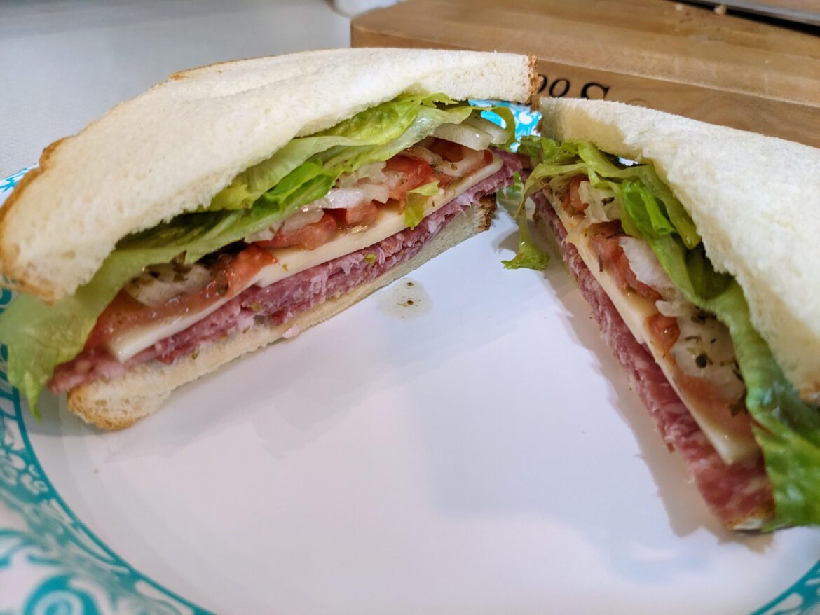 Salami, provolone, lettuce, tomato, onion, vinaigrette, on white bread