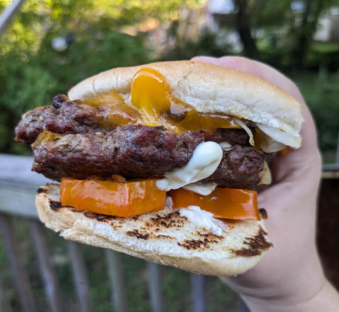Double smashburger with grilled peppers and onions, pickled jalapeños, cheddar and Carolina reaper jack, and mayo