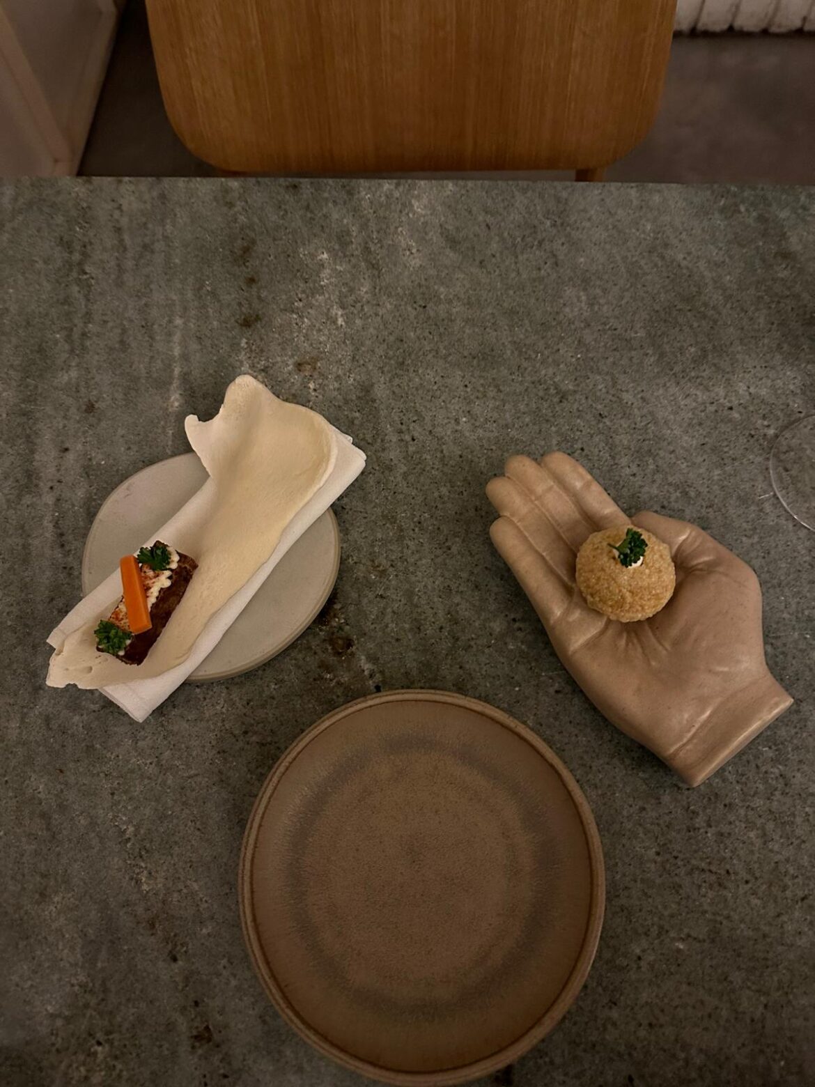 A veggie dish: "It's a mould of the chefs hand and bone of a pig"