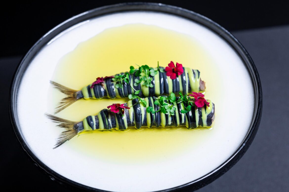 Confit snapper, lemon parsley emulsion, black garlic sauce, warm lemon infused olive oil