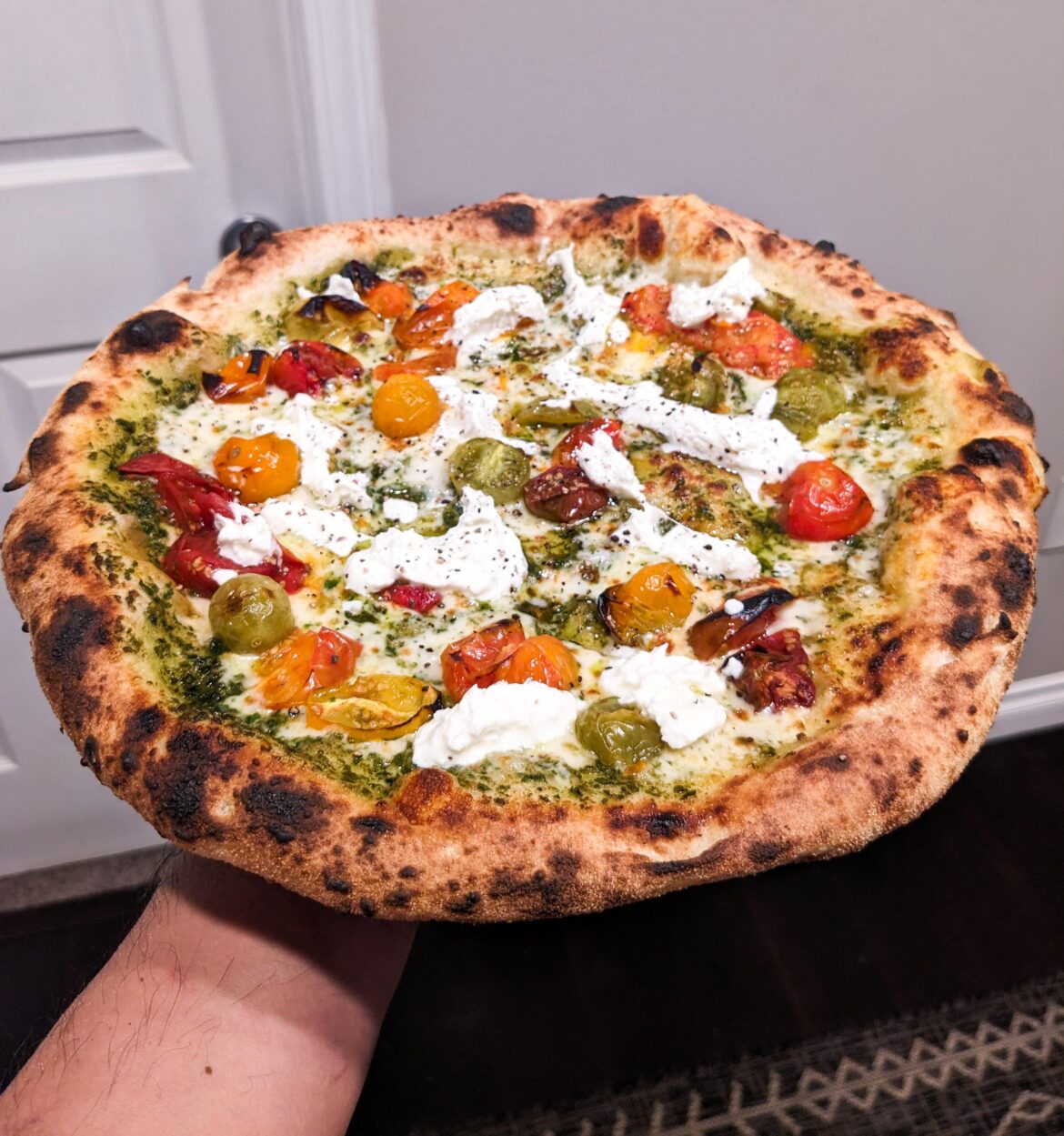 Homemade Pesto, Tomato, and Burrata pizza. Baked in 58 seconds.