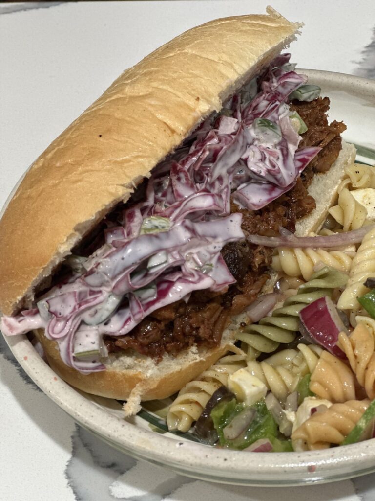 pulled pork w/ cherry brandy bbq sauce and red cabbage/jalapeño slaw