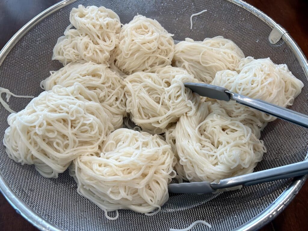 My mom made 오징어뽁음 (squid stir-fry) over 소면 (wheat noodles)