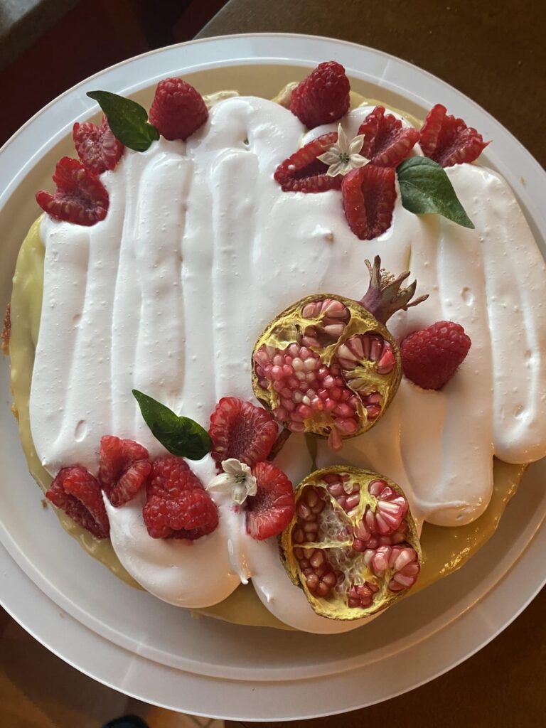 A citrus olive oil cake with lemon curd and a Swiss meringue.