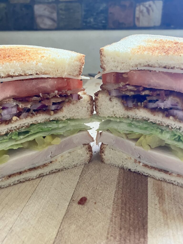 I like ‘em thicc, turkey club edition. Thick turkey, Swiss, lettuce, tomato, onion, bacon, banana peppers, mayo; whole grain mustard