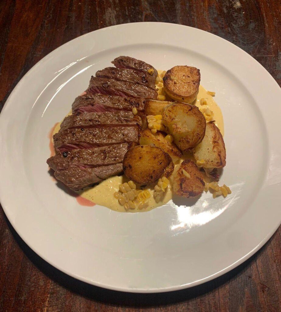 NY strip, sweet corn emulsion sauce, pan roasted potatoes