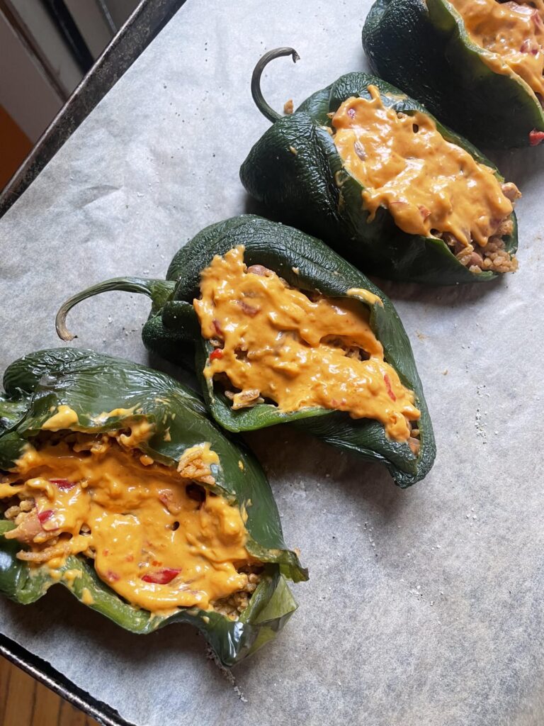 Stuffed poblano peppers with a hatch red chile’ cheese’ sauce 👩‍🍳