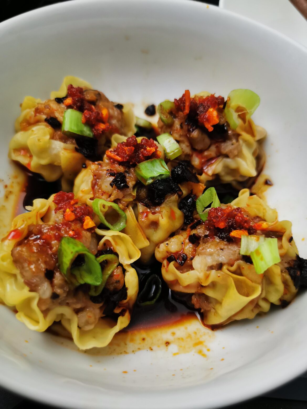 Pork and shrimp shumai (dumplings) topped with S&B crunchy garlic with chili oil.