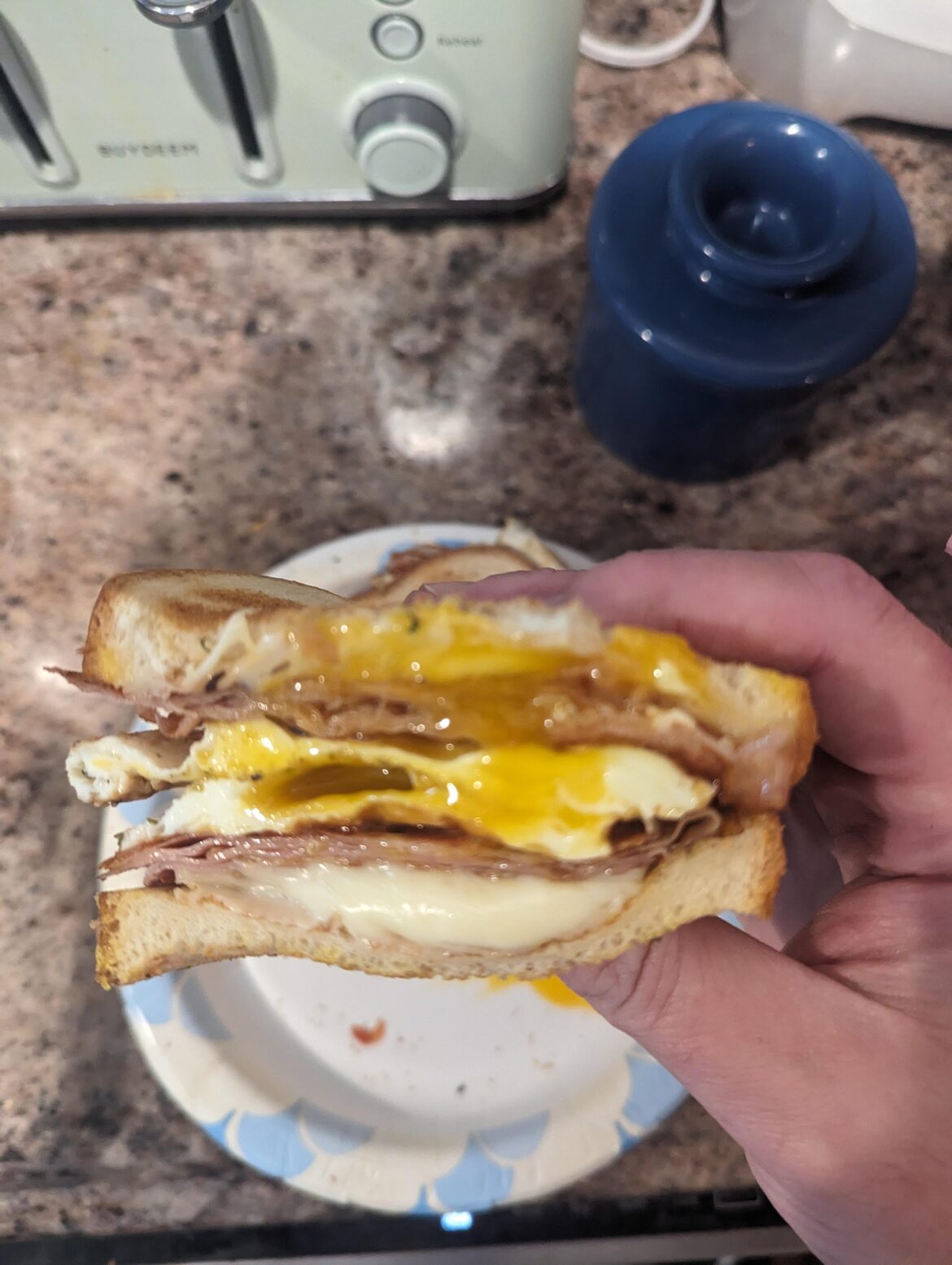 Toasted sweet Hawaiian bread, grilled Virginia ham, an over easy egg, a fried egg and melted Cooper Sharp American cheese. It Was delicious