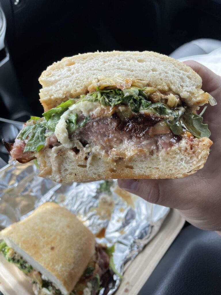 [not homemade] Parmesan chicken cutlet topped w/ prosciutto topped with grilled peaches, arugula, roasted fennel, whipped honey feta spread, balsamic glaze, and fig jam on toasted bread with rosemary fries