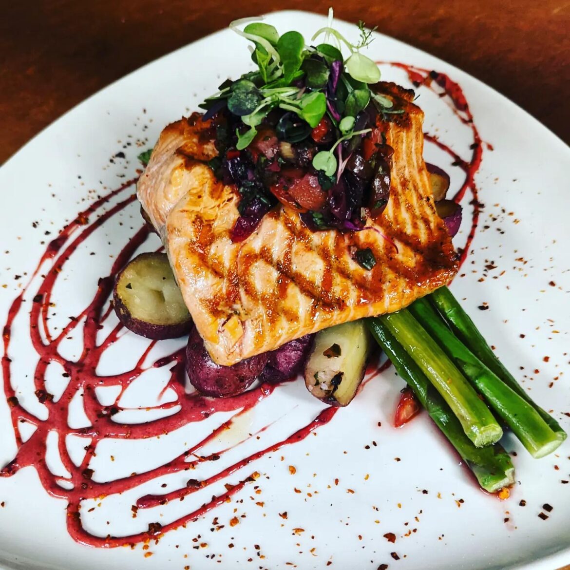 Alder grilled sockeye salmon, baby red potatoes, asparagus, cherry-chipotle vinaigrette, cherry agave salsa, Aleppo pepper