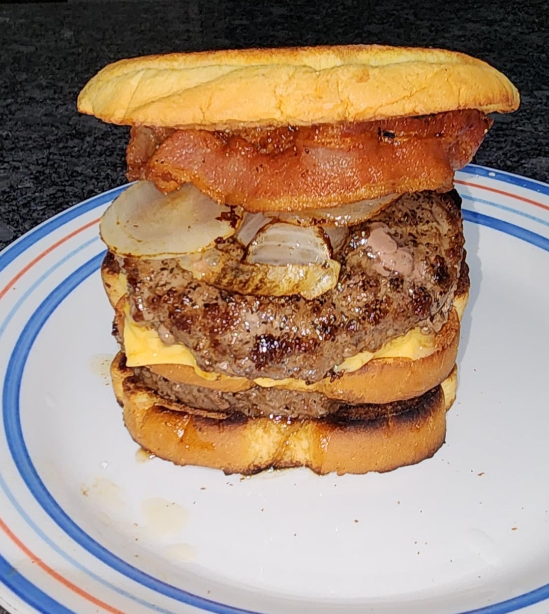 Double bacon cheese burger and eggs sunny side up Dining and Cooking