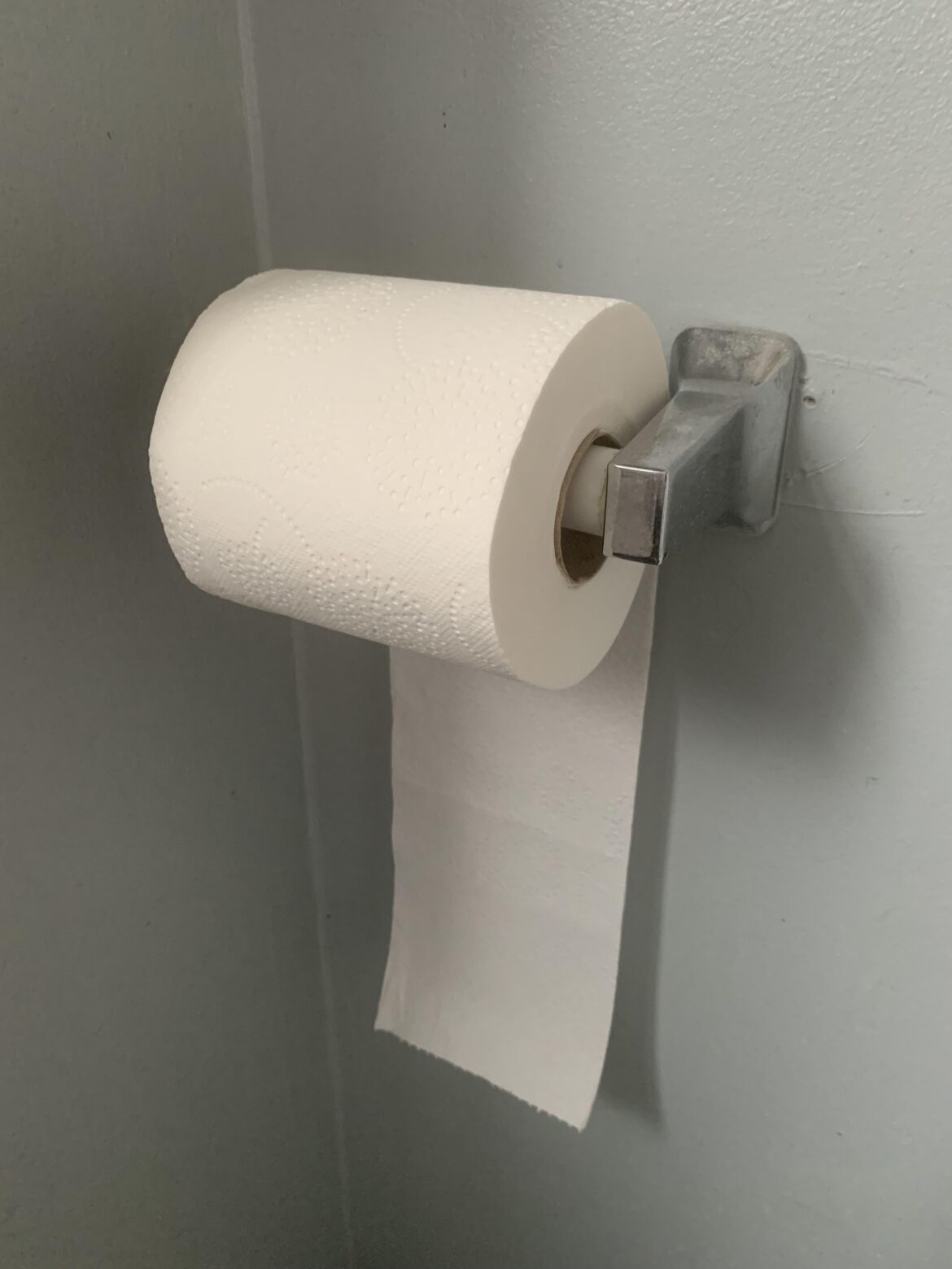 Every time my roommate changes the toilet paper he putsr it in backwards. Why? Is he a psychopath?e
