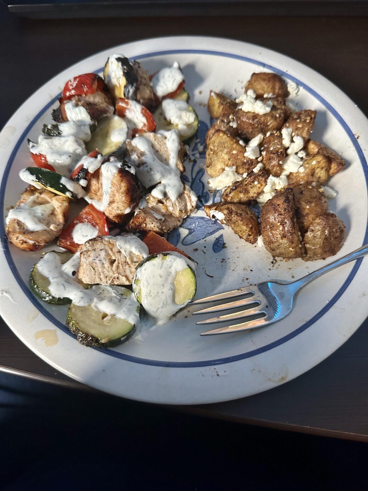 Za’atar kabobs with za’atar potatoes and feta topped with a yogurt sauce